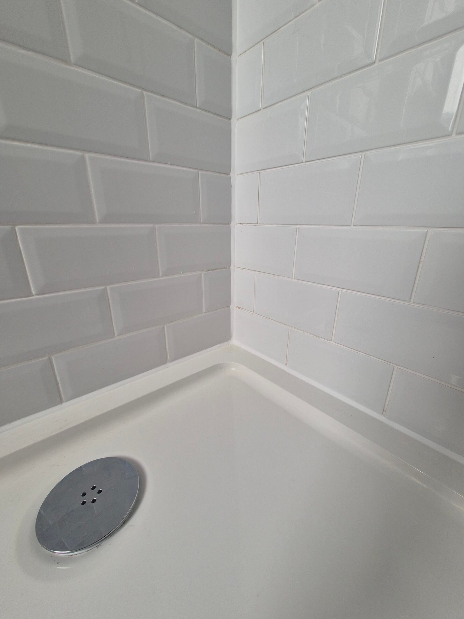 Repaired and resealed shower enclosure after a leak was traced to failed silicone